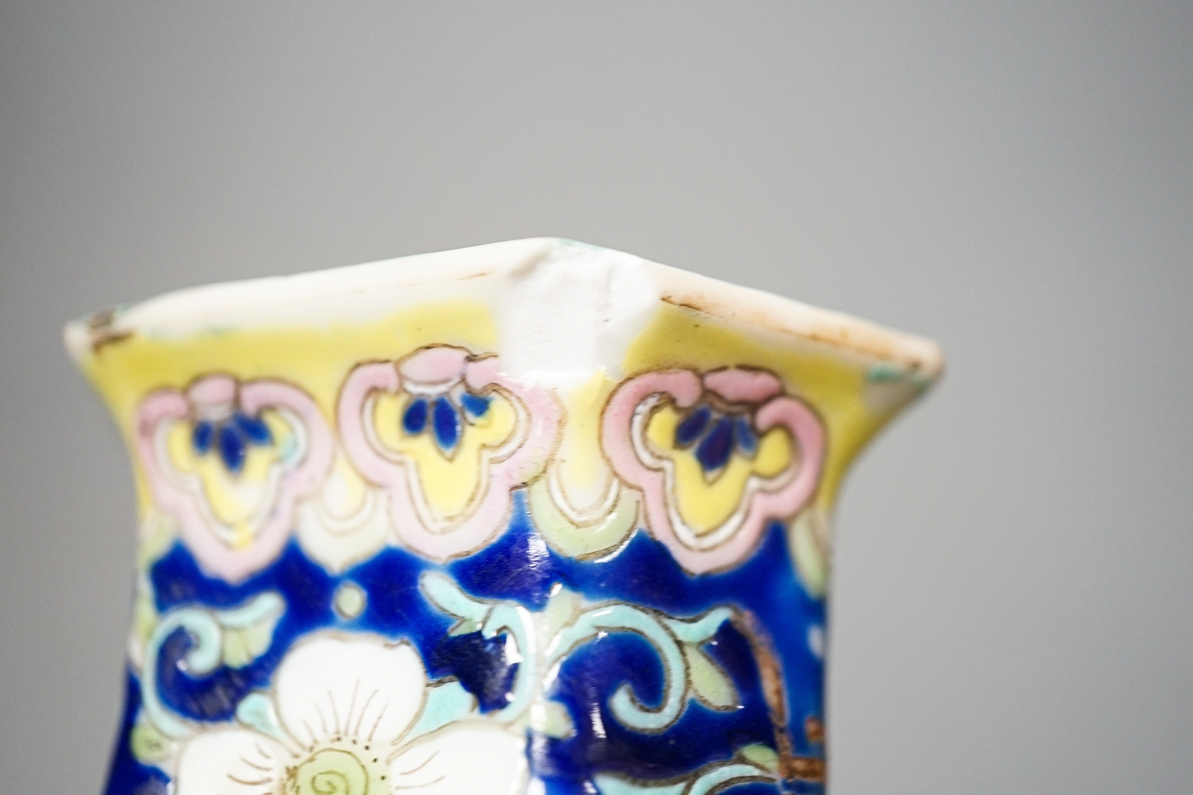 A Chinese blue ground famille rose hexagonal vase, late 19th century, 15cm